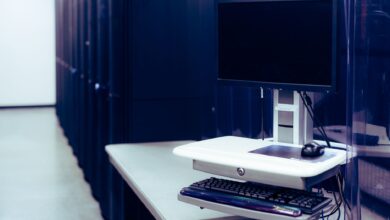 Rows of illuminated servers in a modern data center representing cloud computing infrastructure