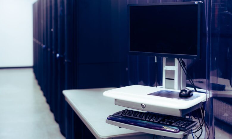 Rows of illuminated servers in a modern data center representing cloud computing infrastructure