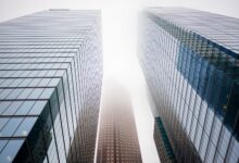 Glass skyscraper exterior representing major private equity and credit firms on Wall Street