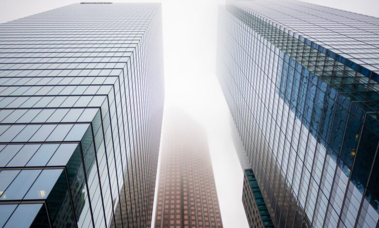 Glass skyscraper exterior representing major private equity and credit firms on Wall Street