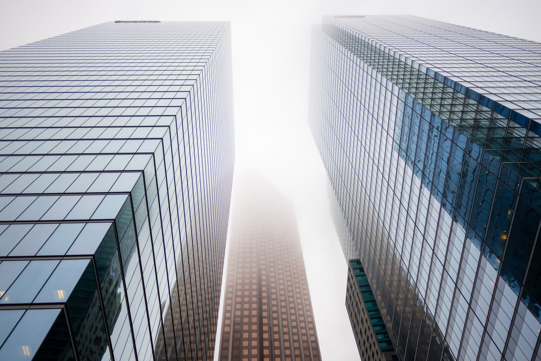 Glass skyscraper exterior representing major private equity and credit firms on Wall Street