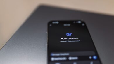 Person holding a smartphone while using a voice assistant feature