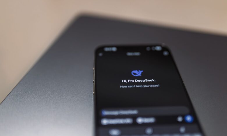 Person holding a smartphone while using a voice assistant feature