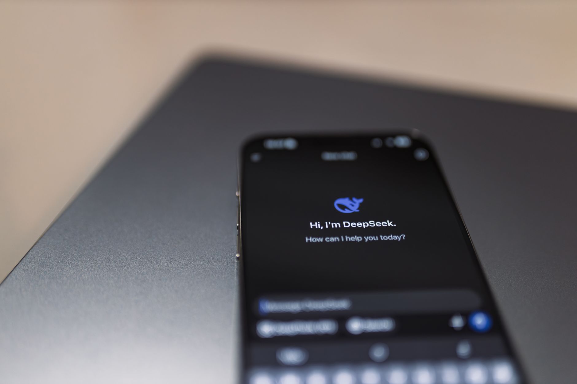 Person holding a smartphone while using a voice assistant feature