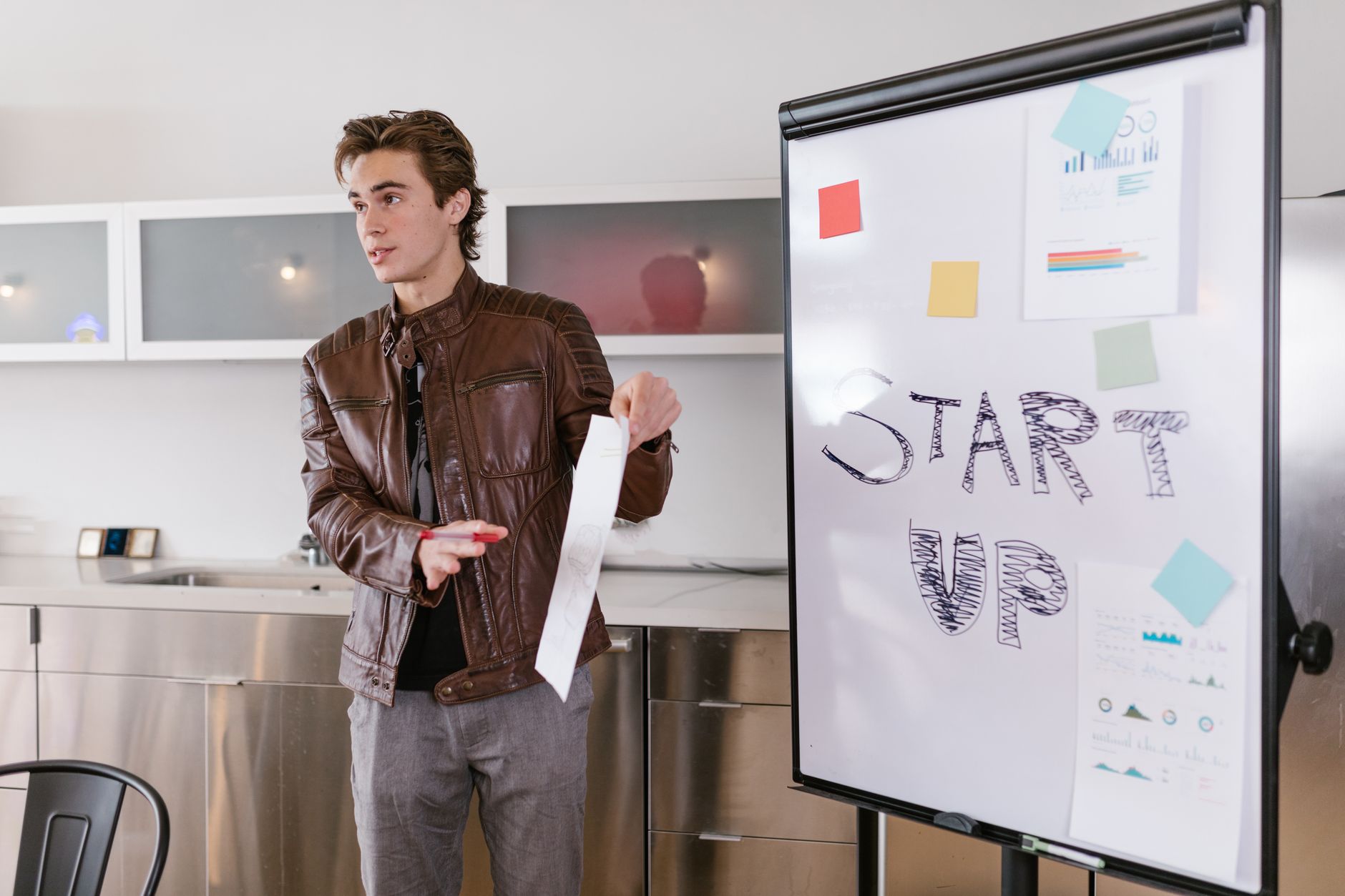 Business professionals in a meeting room discussing investment strategy