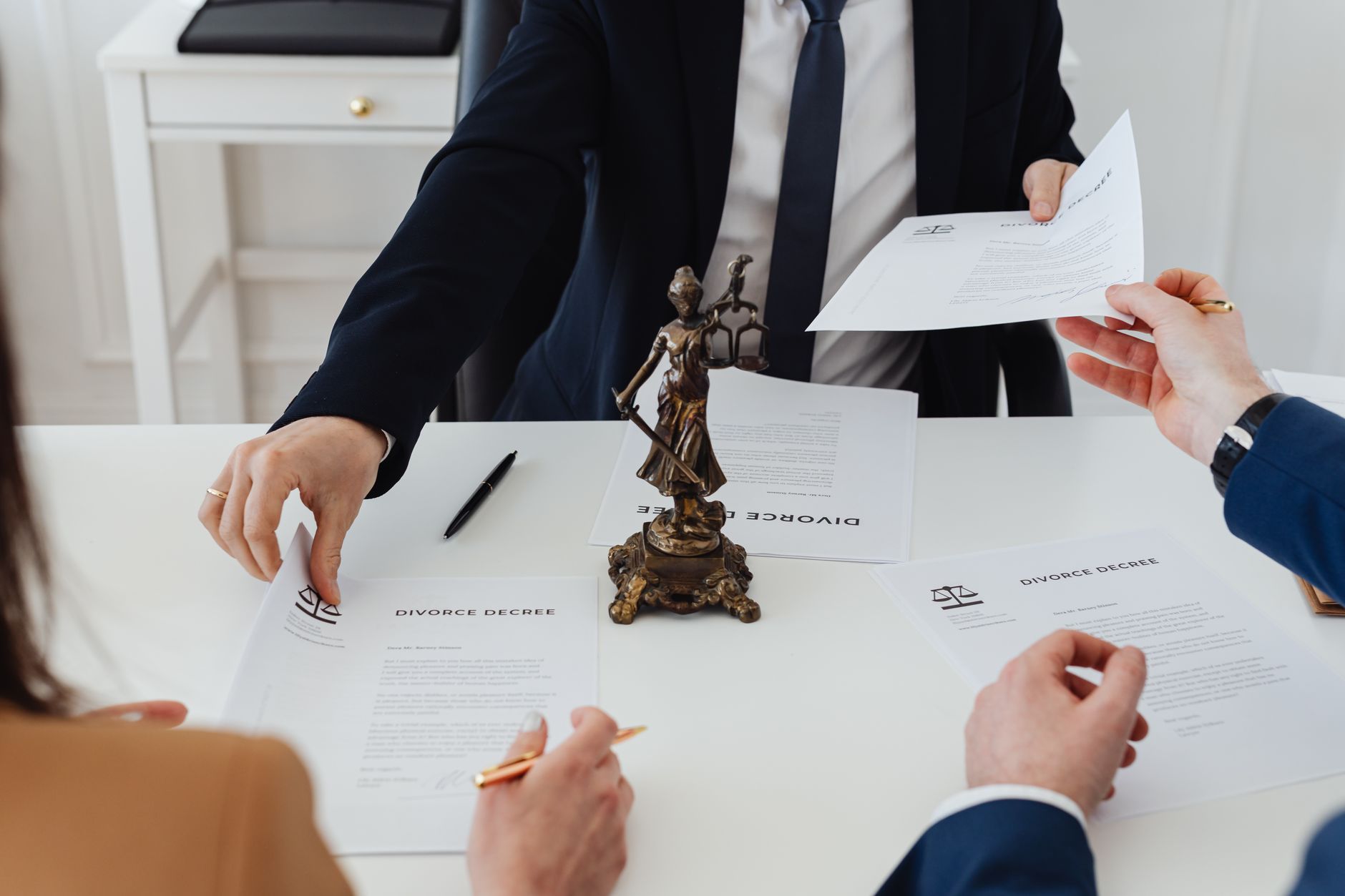 Legal documents and papers spread across a corporate office desk