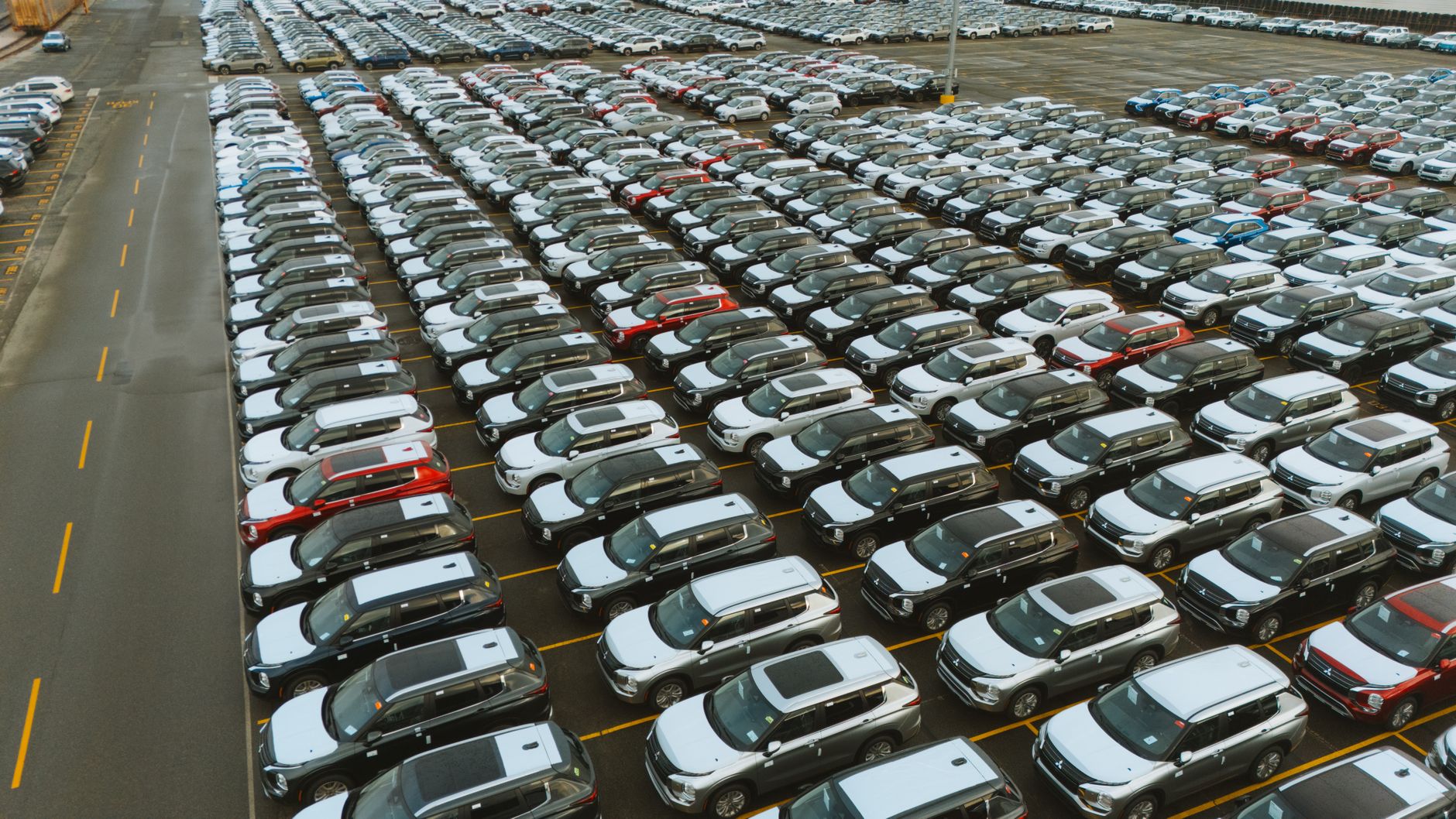 A fleet of electric vehicles parked in a lot representing commercial ride-hailing operations