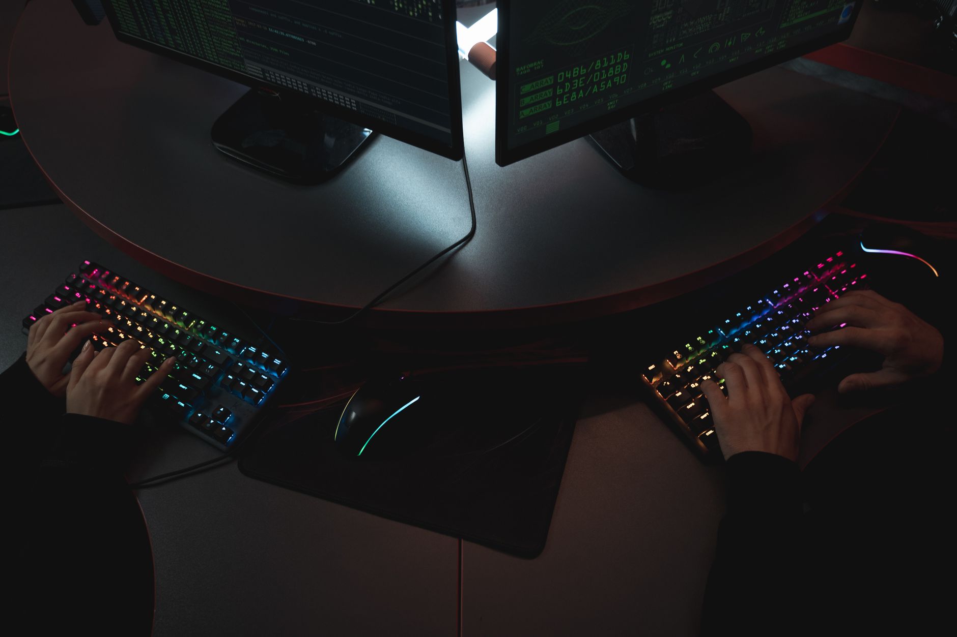 Security professionals working at computers in a modern cybersecurity operations center