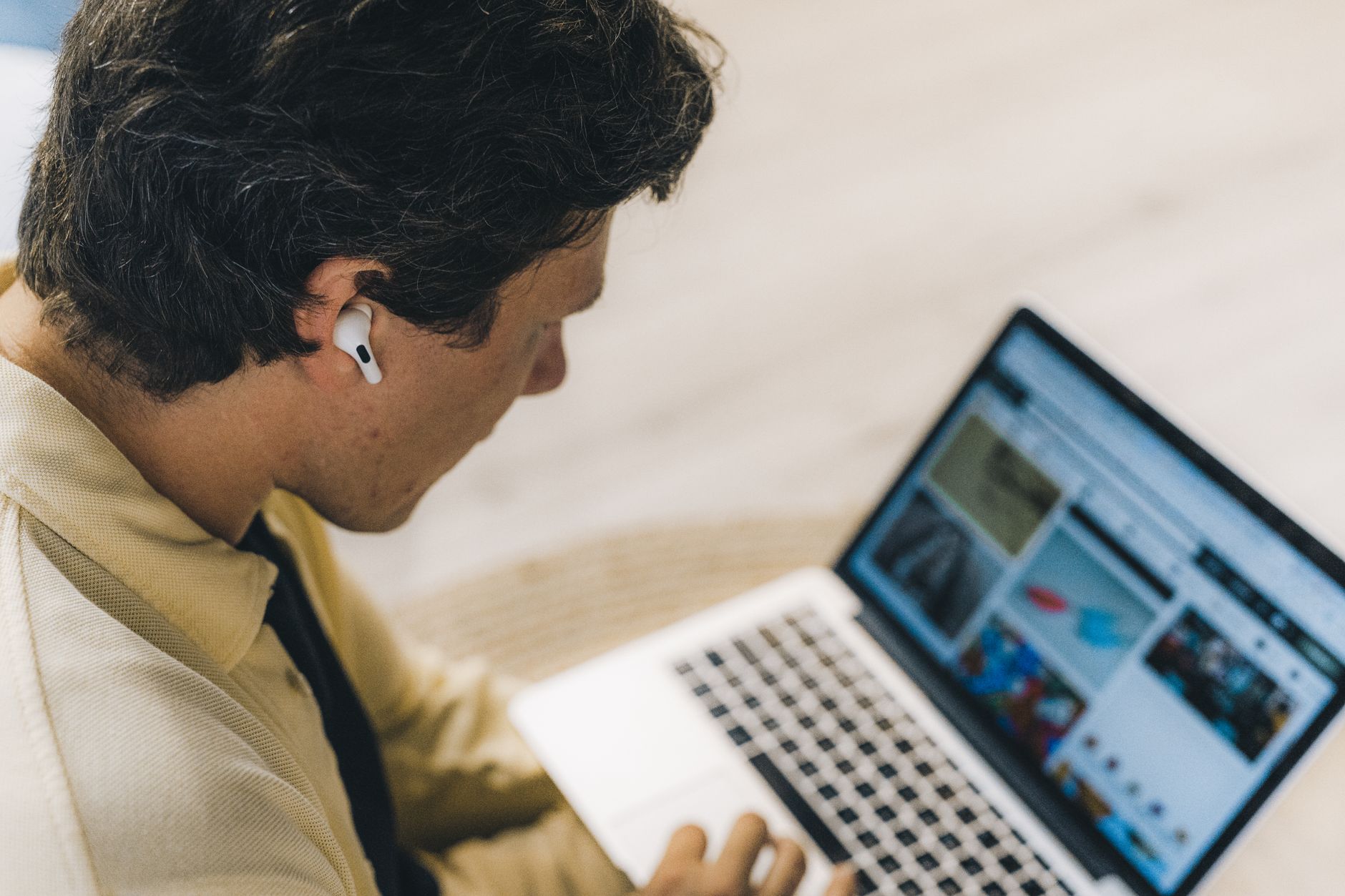 Professional working remotely on a laptop managing distributed team operations