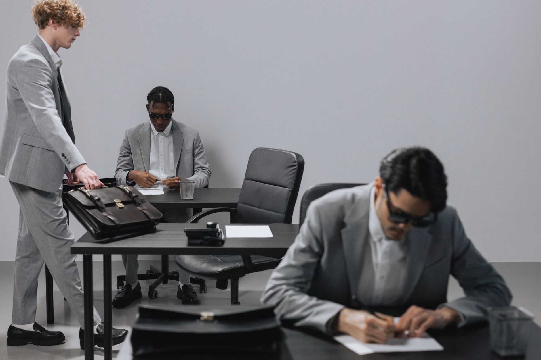 Business professionals reviewing deal documents at a conference table