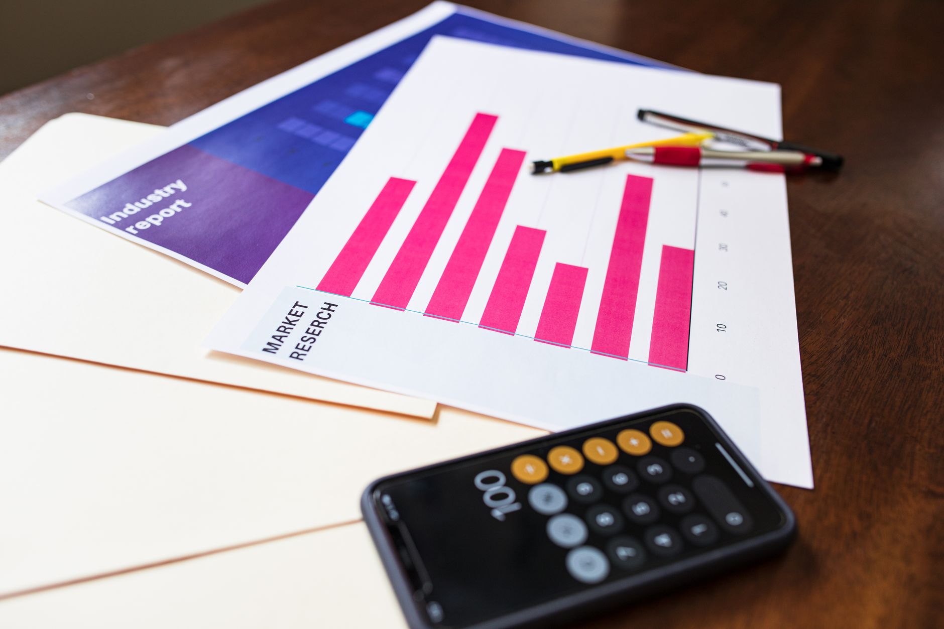 Financial performance charts on a desk representing fund portfolio analysis