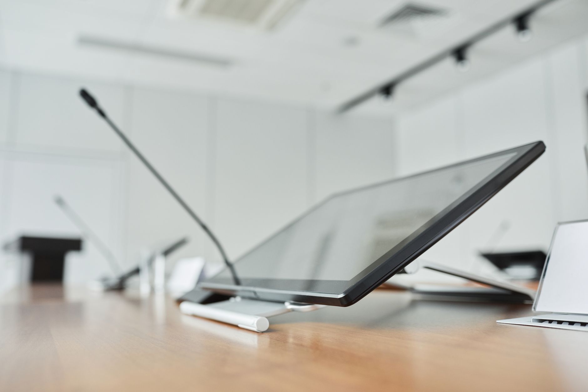 Business professionals reviewing technology infrastructure plans in a corporate meeting room