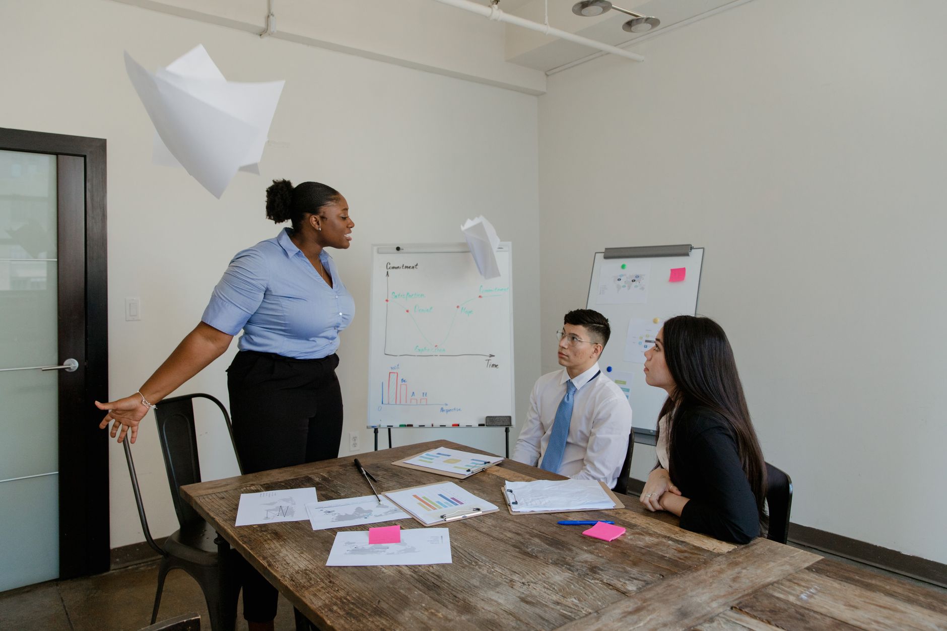 Business professionals in a meeting discussing corporate payment strategy and financial planning
