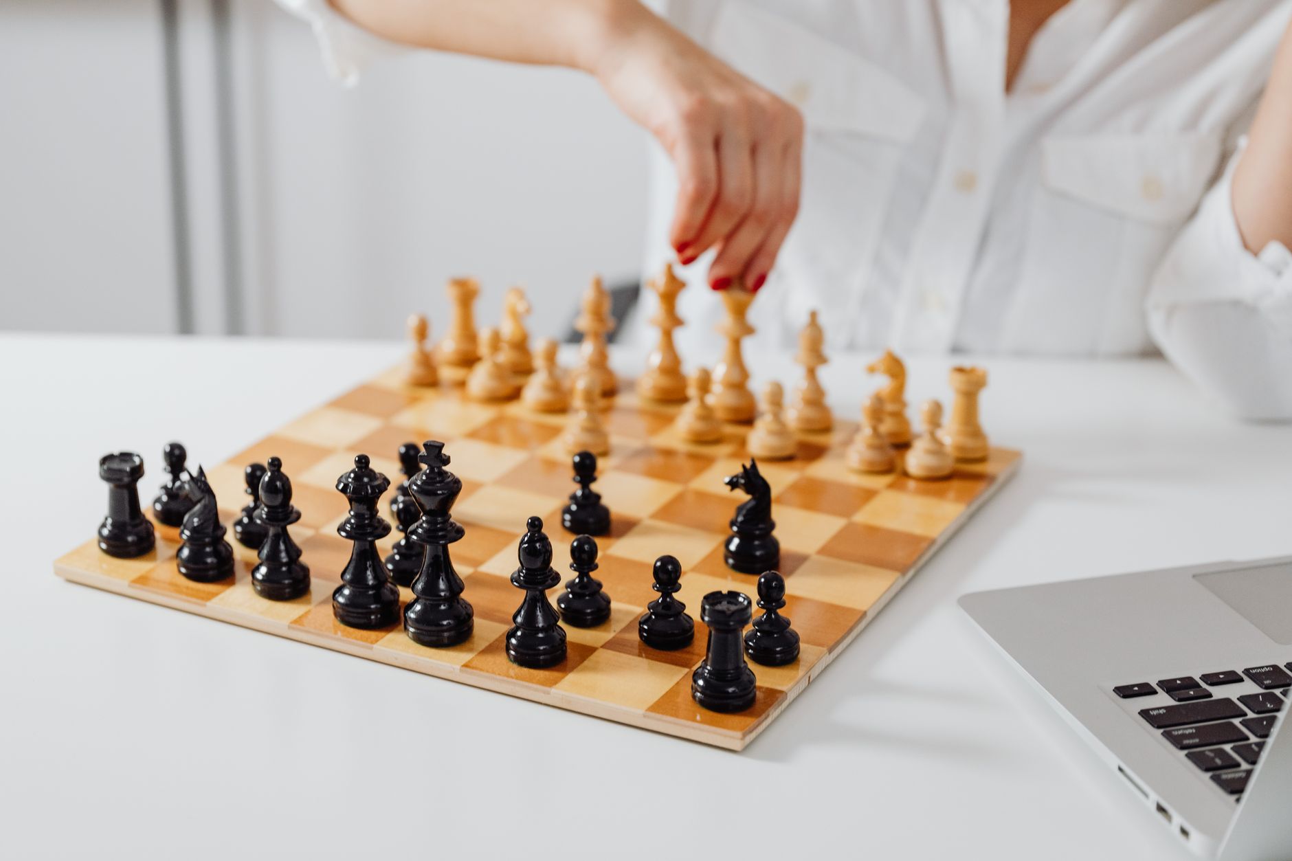 Two businesspeople reviewing strategy documents representing competitive dynamics between enterprise software companies