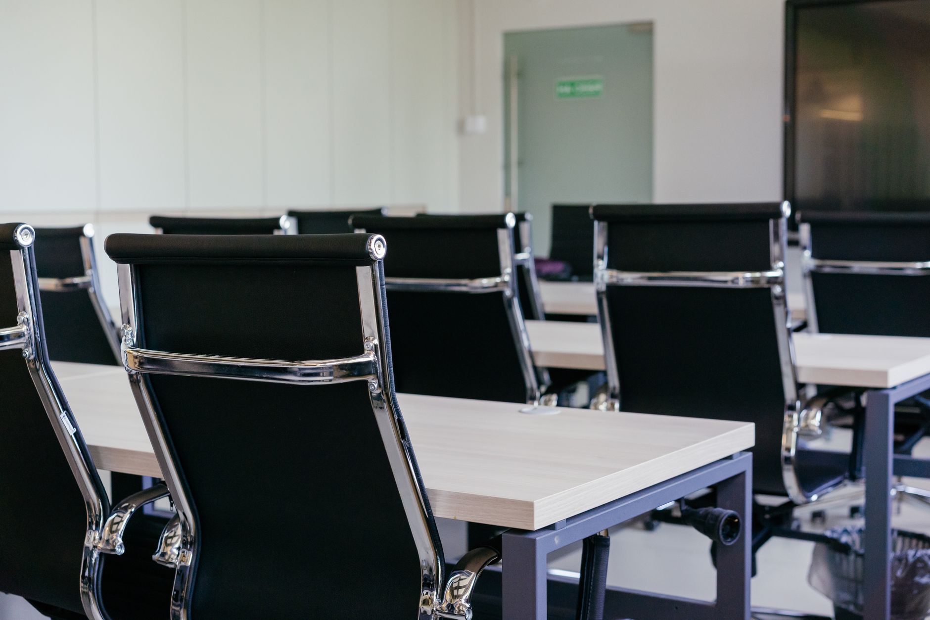 Executives in a corporate meeting room discussing technology strategy
