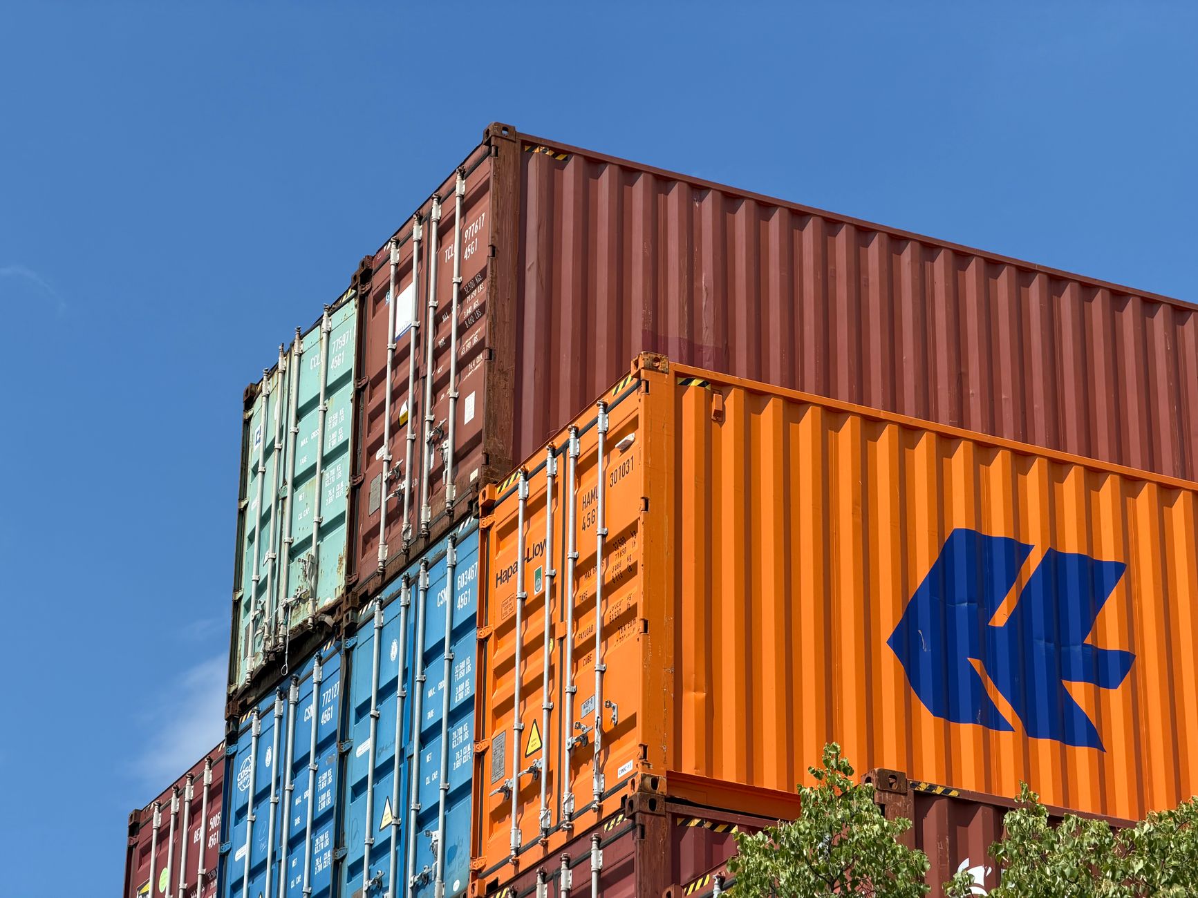 Cargo containers at a port representing global trade and export restrictions