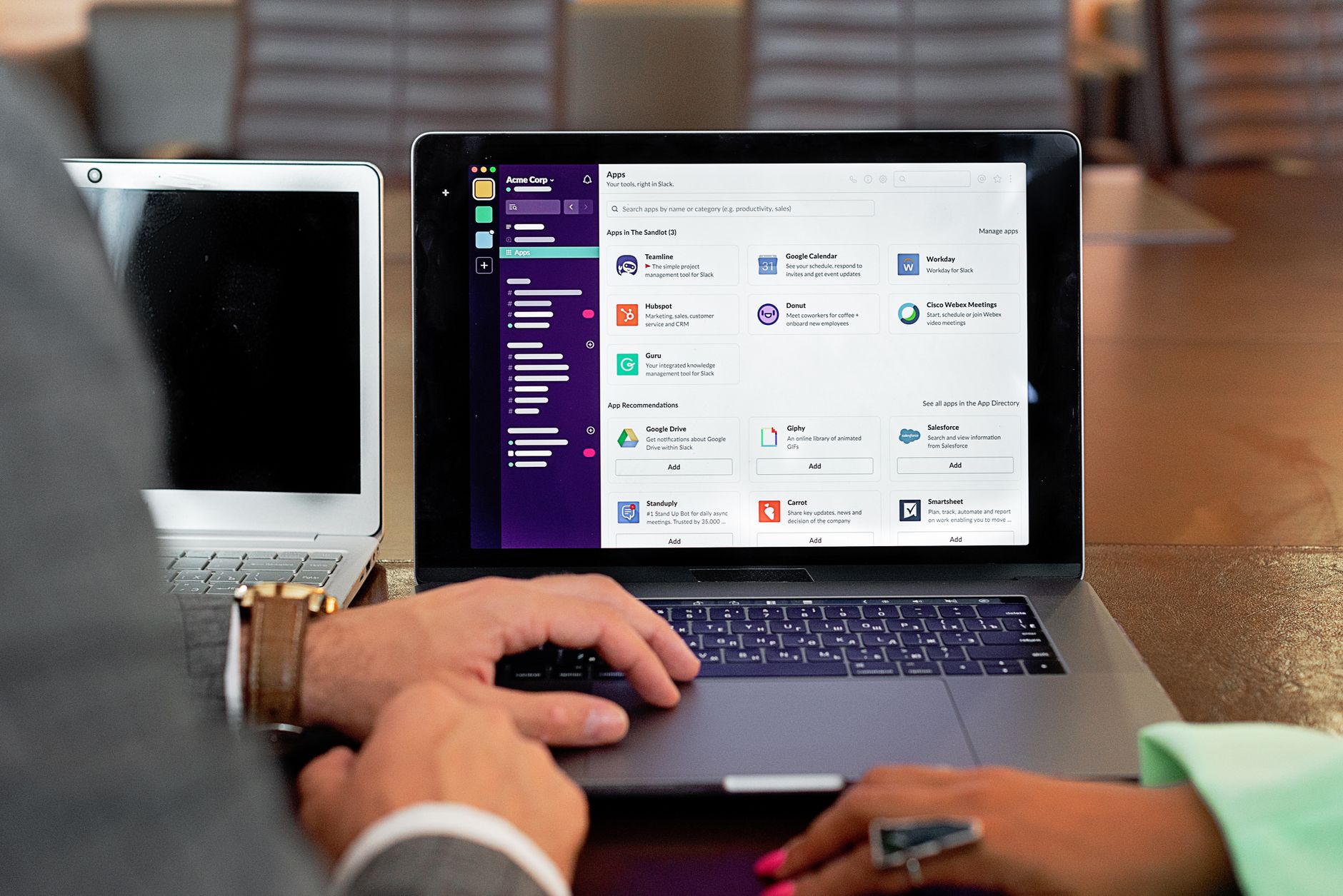 A clean desk workspace with a computer displaying productivity software